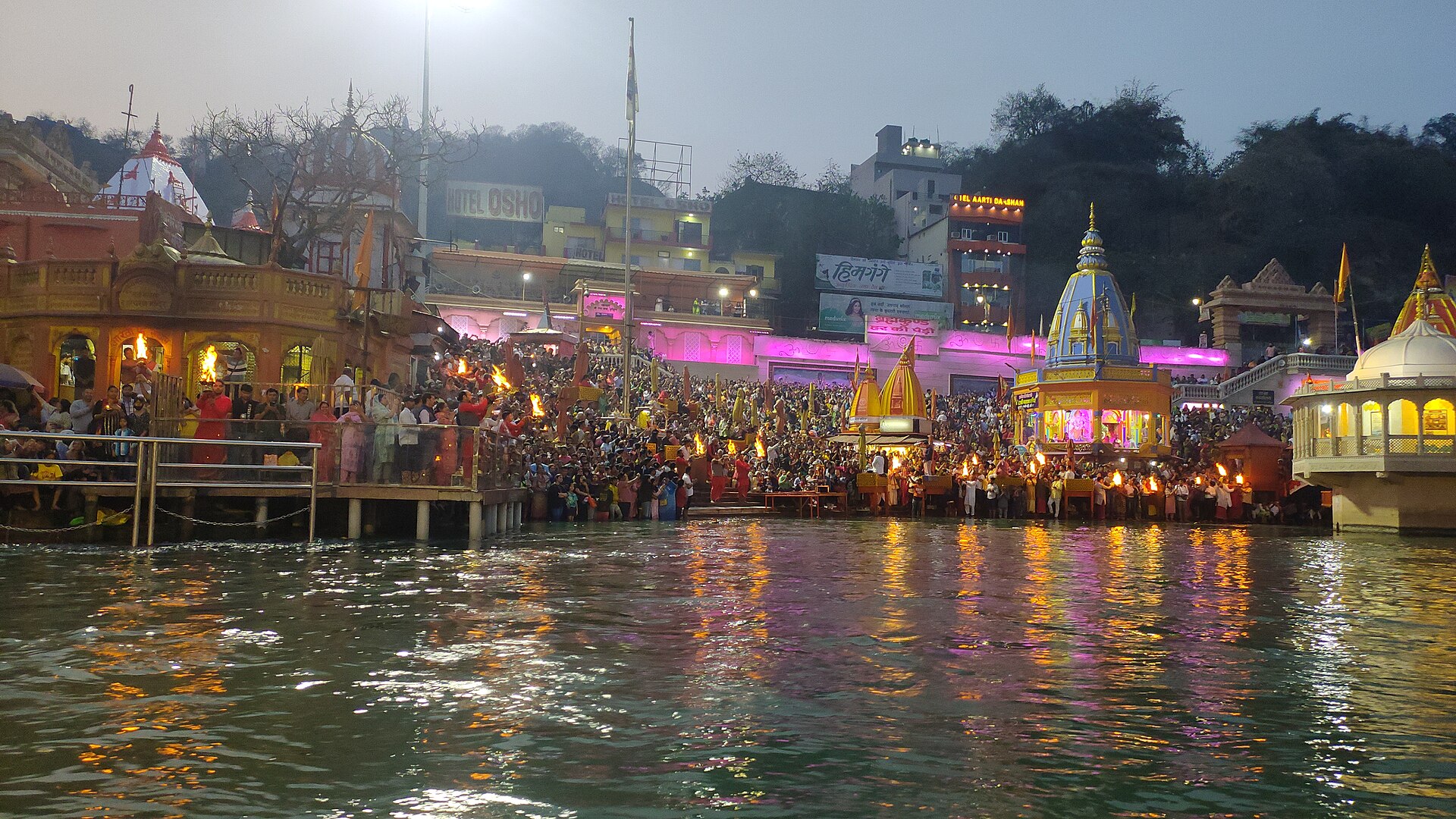 Brass diyas glowing on the stone steps of Haridwar ghats